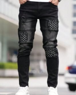 TAPERED JEANS WITH HOLES IN A MODERN DESIGN